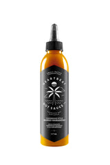Heartbeat Hot Sauce Co. front bottle view showing vibrant mango-habanero color and label benefit