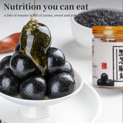 Hee Creek open black sesame ball cross-section revealing dense honey-bound interior