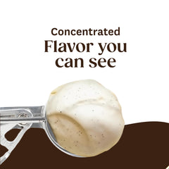 Spoon pouring Heilala paste into batter demonstrating rich flavor boost