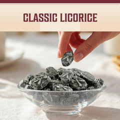 Hermann the German candies in hand showing scale and convenient snacking portability benefit