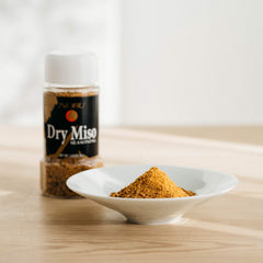 Hikari Miso dry miso flakes sprinkled on salad adding immediate umami and bright finishing flavor
