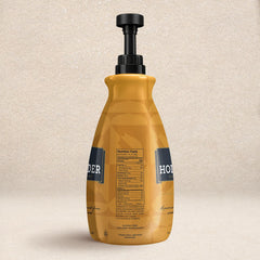 Hollander Chocolate pump dispensing caramel sauce for precise portions and less waste