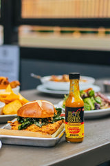Hot Ones sauce used on chicken wings demonstrating bold taste enhancement