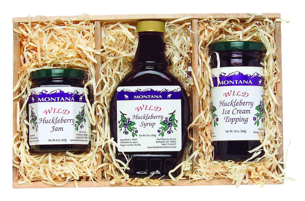 Huckleberry Haven front packaging in plywood crate showing trio and gift-ready appeal