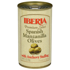 Iberia 5.25 oz can next to drinking glass for size comparison and convenience