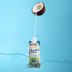 Iberia carton open pouring coconut water illustrating clear liquid and easy pour convenience