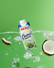 Iberia carton held in hand for scale to show portable 11.1 fl oz size and grab-and-go benefit