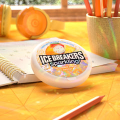 Ice Breakers tin tucked into a jeans pocket illustrating portability and instant refreshment