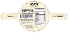 Ika's Garden close-up of smooth mustard on spoon highlighting bold flavor