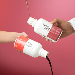 Immunotec Xtra Sharp one-ounce serving in hand demonstrating portable use and sustained energy support