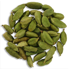 Indian Spice close-up of green cardamom pods texture, showing intact pods for maximum aroma