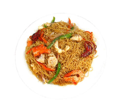 Indomie prepared mi goreng plated with garnish showing ready-to-eat appeal