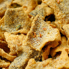 IRVINS seasoning detail with salted egg and curry leaves showcasing authentic flavor profile