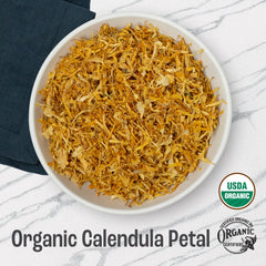 J MAC BOTANICALS closeup dried calendula petals texture displays vibrant color and purity