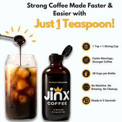 Jinx Coffee concentrate being poured into water showing rich color and easy mixing