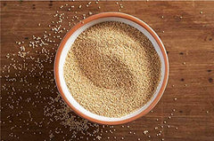 Jiva Organics amaranth flour in bowl beside pancakes, showing versatile cooking use