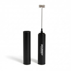 Journey Supplements handheld frother creating creamy foam for cafe-style drinks on the go