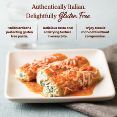 Jovial baked stuffed manicotti on a plate showing structure and appetizing finish