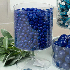 Just Candy blue raspberry jelly beans being scooped into a clear candy jar for displays