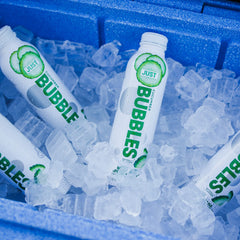 JUST Water bottle cap detail showing resealable screw-top for preserving carbonation