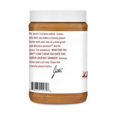 Justin's Nut Butter crunchy spread on spoon close-up showing texture and crunchy bite