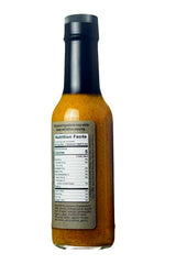 Karma Sauce Ghost Island ingredient label visible on bottle, emphasizes preservative-free clean recipe