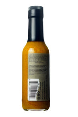 Karma Sauce Ghost Island sauce texture close-up on spoon, highlights thick fruit-forward consistency