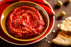 Kartago harissa used as marinade on chicken delivering bold flavor and caramelization