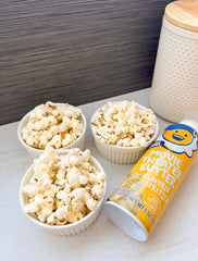Kernel Season's bottle beside common items showing handy 5-ounce size