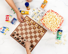 Kernel Season's shaker next to popcorn bag showing portable size and easy storage