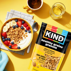 KIND resealable bag beside a measuring cup, demonstrates portion and storage benefit