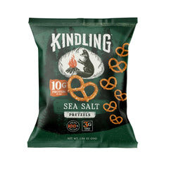 Kindling bag open pouring pretzels into hand highlighting portability and ready-to-eat benefit