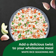 Knorr Mi Arroz being added to rice in a pot for fluffy non-sticking rice