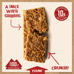 Kodiak Cakes bar in hand on trail illustrating portable snack convenience