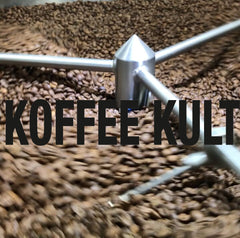 Koffee Kult beans beside a scale demonstrating 32oz quantity and value