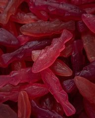 Kolsvart candies served in a bowl with fresh berries to show flavor pairing and appeal