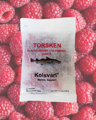 Kolsvart bag held in hand to demonstrate 4.2 oz portion size and convenient portability