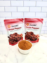 KomBei Suya Spice HOT on grilled steak in use adding smoky, spicy crust for flavor