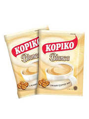 Kopiko Blanca instant mix dissolving into hot water for a smooth creamy cup