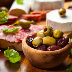 Krinos olives on a charcuterie board enhancing platters with Mediterranean taste