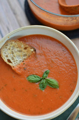 La Madeleine close-up pouring soup highlighting creamy texture and basil aroma