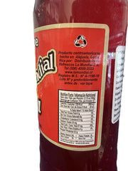 La Mundial syrup poured into glass with ice demonstrating easy mixing benefit