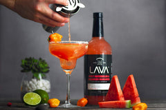 LAVA being poured over ice to show easy prep and consistent cocktail results