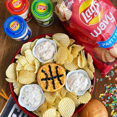 Lay's Creamy Ranch dip cup beside potato chips showing easy dipping benefit