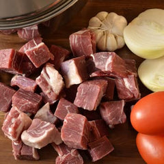 Lead Foods sliced carne seca on cutting board ready for shredding benefit