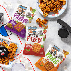 Lenny & Larry's pretzel bag in hand showing 3oz single-serve portion convenience