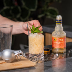 Liber & Co. orgeat being poured into a Mai Tai cocktail for balanced sweetness