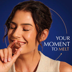 Lindt LINDOR truffle in hand for scale and portion convenience benefit