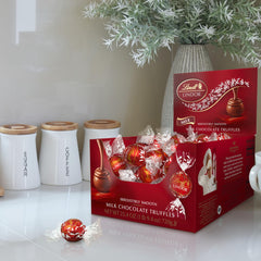 Lindt LINDOR truffle cross-section revealing smooth melting center enjoyment