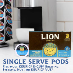 Lion Coffee pod beside grounds and macadamia nuts, highlighting Arabica quality and flavor notes